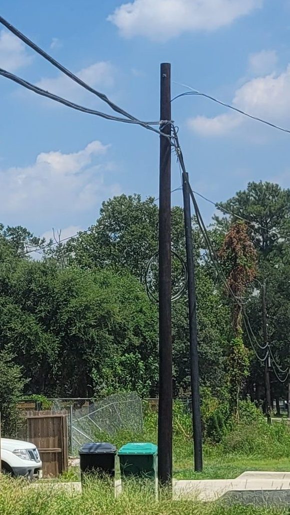 Image of the two data wires coming off the telephone pole, with the low hanging wire actually being the high wire